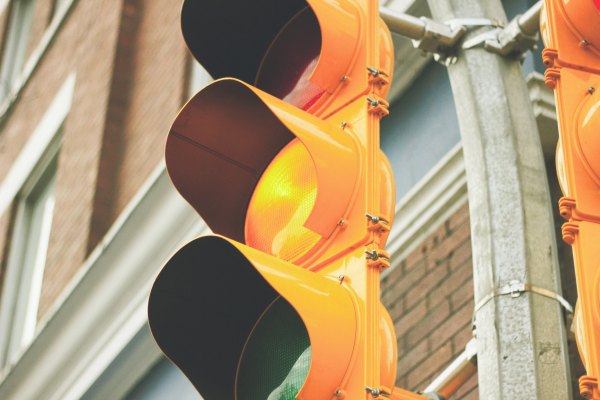 yellow traffic light, how we move through business ethics